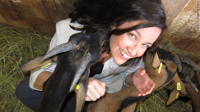 Catherine Price is surrounded by baby goats at a dairy farm in France. The avid traveler spoofs "bucket lists" in her book.
