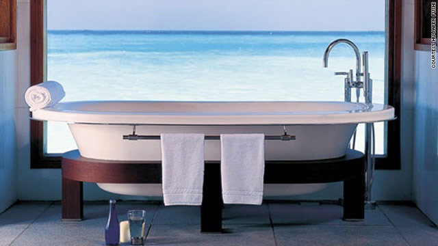 Enjoy the priceless view as you soak in this bathtub at the Huvafen Fushi resort in the Maldives.