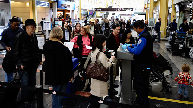 Travelers go through a security checkpoint at Reagan National Airport in Arlington, Virginia, last week.