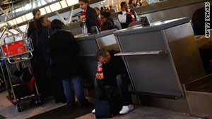 Travelers trying to rebook flights face busy phone lines and stiff competition for available seats.