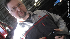 Mike Gaige of Parkway Toyota in Englewood Cliffs, New Jersey, shows where parts will go to fix Toyota accelerators.
