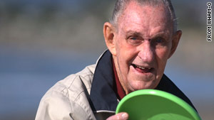 Walter Fredrick "Fred" Morrison holds a Frisbee in a photo from Wham-O's Web site. He invented the flying disc.