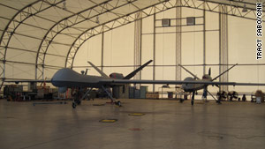 Predator B unmanned vehicles wait to be deployed inside a hangar at Fort Huachuca, Arizona.
