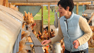 Owner Alexis Koefed gathers eggs at Soul Food Farm on the outskirts of San Francisco, California.