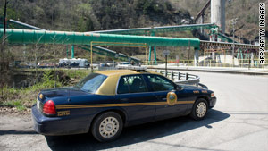 A West Virginia state police car is parked Tuesday outside the coal mine where Monday's fatal blast happened.