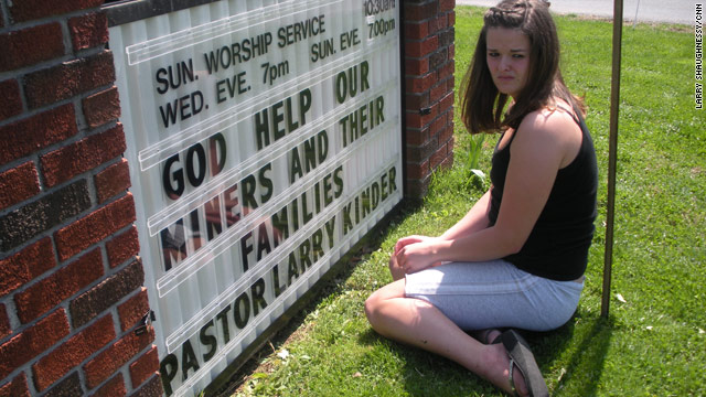 Crista Dickens shows her community's support for the miners with a message on a chapel sign in Arnett, West Virginia.