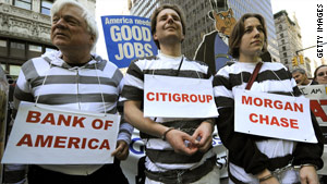 Protesters march in New York on Thursday, calling for banks to be held accountable for their role in the recession.