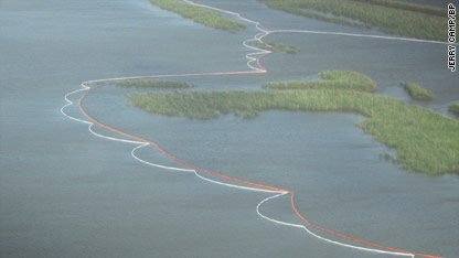 Authorities battled the Gulf of Mexico's massive oil spill with sweat, steel and fire