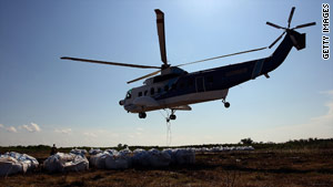 A Louisiana National Guard helicopter assists in the oil spill area on Tuesday.