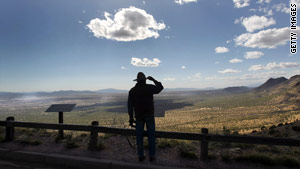 A rancher scans the Mexican border from Arizona, which critics say has less protection than Texas and California.