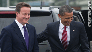 U.S. President Barack Obama greets British Prime Minister David Cameron at the G8 meetings in Toronto, Ontario.