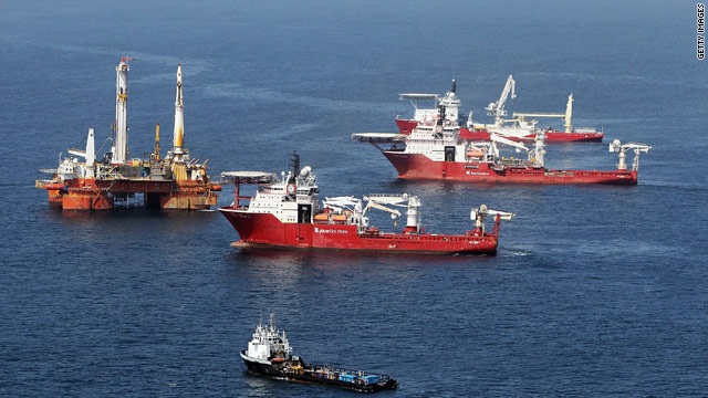Ships assist collection of oil Friday near the source of the Deepwater Horizon leak before leaving to avoid a storm.