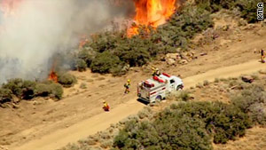 In Los Angeles County, firefighters now have the Crown Fire mostly contained. Good weather has helped.