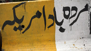 "Death to America" scrawled on a highway divider in Islamabad. Al Qaeda still recruits heavily in Pakistan.