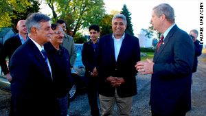 U.S. Agriculture Secretary Tom Vilsack (right) chats Friday with Mohammad Asef Rahimi (center) from Afghanistan and Nazar Muhammad Gondal (left) of Pakistan.