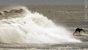 Hurricane Bill creates strong waves off a New York beach in August. Last year's hurricane season was below average.