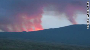 Lava-sparked fires burn on the slopes of Mount Nyamuragira on Saturday morning.