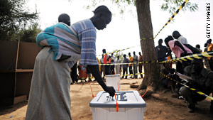 A South Sudanese woman casts her ballot on Sunday.