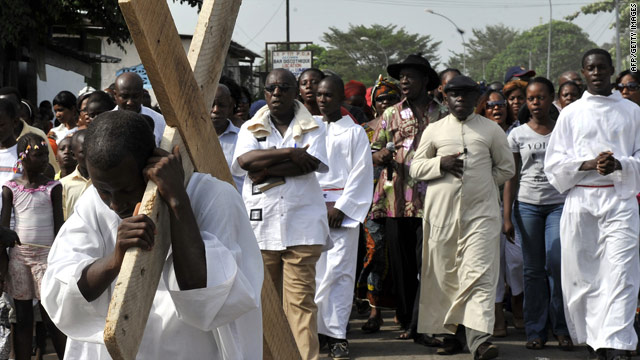 A man performs the Stations of the Cross during the Good Friday procession earlier this month in Abidjan, Ivory Coast.