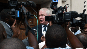 Roy Bennett speaks to the press outside the High Court in Harare, Zimbabwe, in March.