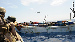 U.S. naval forces investigate a suspected pirate skiff in the Gulf of Aden earlier this year.