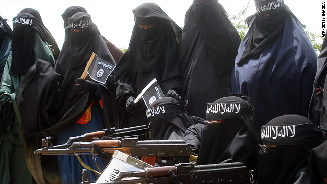 Women pose with weapons at an Al-Shabaab demonstration against the Somali government in Mogadishu.