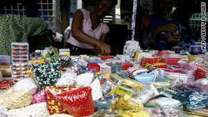 Women sell smuggled, counterfeit medicine in June 2007 at a market in Abidjan, Ivory Coast.