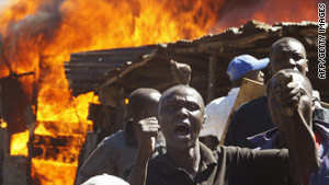 Residents of a Nairobi slum shout at demonstrators during clashes after the 2007 disputed election.