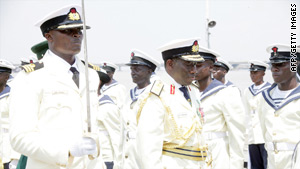 Nigerian President Goodluck  Jonathan, center, inspects guard of honour Thursday at the Naval Western Command in Lagos.