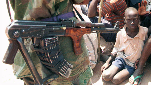 An image taken on September 2, 1998, of an armed rebel soldier near a group of people in Kalemie, in the eastern part of the DRC.