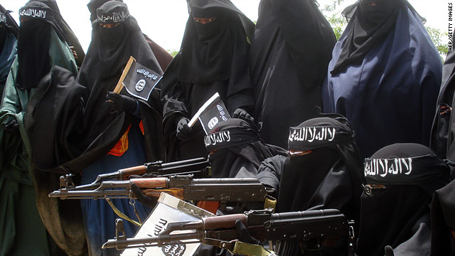 Somali women carry weapons during a demonstration organized by the islamist Al-Shabaab group iin Mogadishu on July 5, 2010.