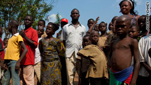 Ivorian refugees wait for aid in Guinea last week.  Thousands have also fled to Liberia, according to the U.N.