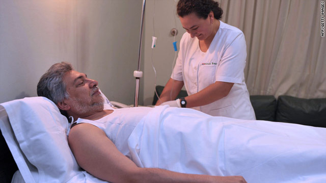 A nurse prepares Paraguayan President Fernando Lugo for surgery, January 8, 2010.