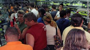 Venezuelans jam into an appliance store last weekend in anticipation of price hikes.