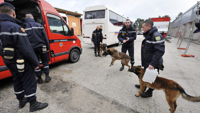 French search teams with sniffer dogs prepare to leave for Haiti, as nations rally to offer assistance.