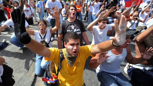 Students shout slogans at a protest against the suspension of the signal of private RCTV broadcaster in Caracas on Monday.