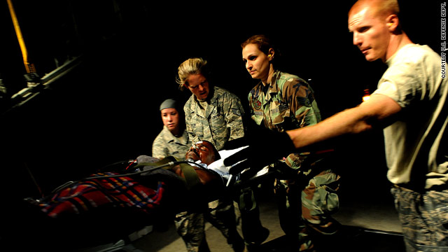 U.S. Air Force medics carry a Haitian patient onto an aircraft to be flown to Miami, Florida, last week.