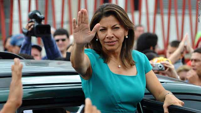 Costa Rican presidential candidate Laura Chinchilla of the ruling National Liberation Party greets supporters in San Jose Sunday.