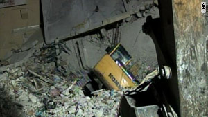 An excavation machine tipped into a hole and caused a collapse, workers say.