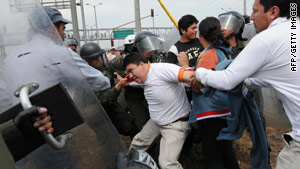 Demonstrations over plans to implement a new transport system in Bogota erupt into street clashes.