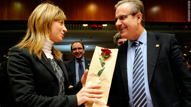 Spanish Equality Minister Bibiana Aido Almagro recieves flowers from a colleague on International Women's Day.
