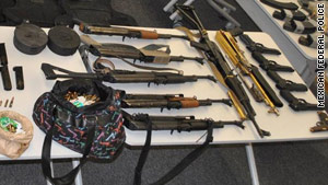 Pictures from the arrests showed an arsenal of weapons and ammunition seized during the captures.