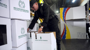 A Colombian police officer inspects electoral forms at a polling center in Medelllin on May 29.