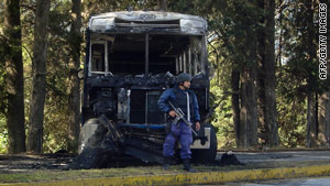 Ten Mexican police and an undisclosed number of criminals were killed in the convoy attack Monday, said officials.