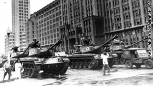 This photo from 1964 shows a scene from a military takeover Brazil. Tanks and soldiers move into Rio de Janeiro.