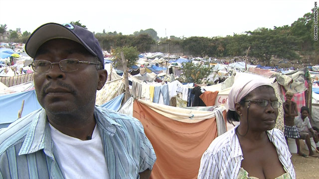 Michel and Eliane Clervil survey a camp shortly after the January 12 earthquake in Haiti. Soon more tragedy would strike