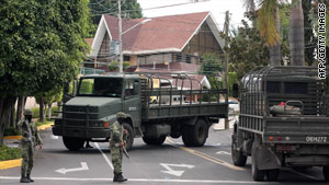 Mexican anti-drug units stand guard after a raid that killed alleged drug lord Ignacio Coronel Villareal last week.