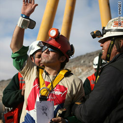 Trapped miners surface amid jubilant scenes