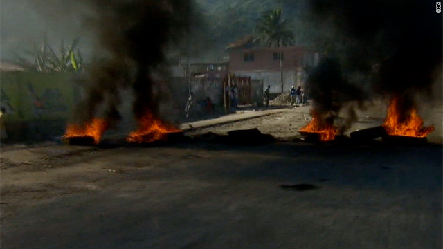 Angry over the cholera epidemic, demonstrators have put up networks of barricades through the streets of Cap-Haitien, Haiti.