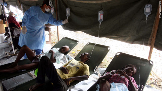 Cholera patients rest at a makeshift hospital in Hinche, Haiti, on Sunday.